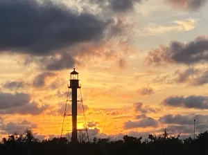 a group of clouds in the sky over a body of water