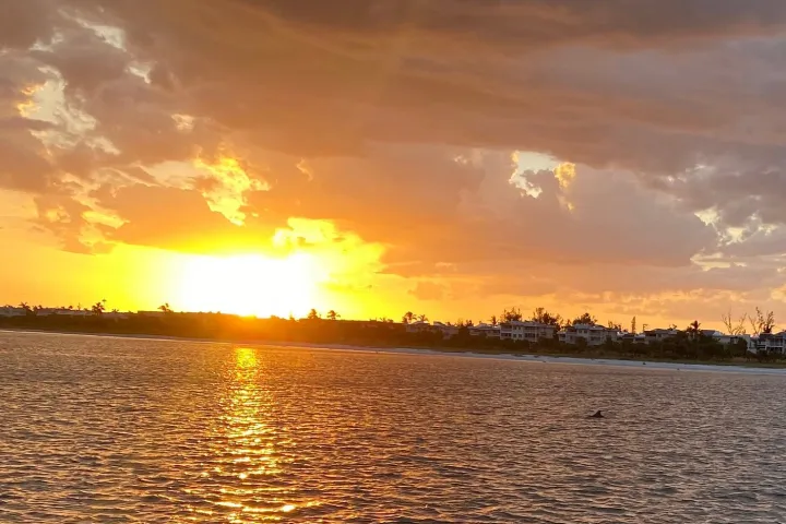 a sunset over a body of water