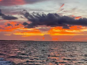 a sunset over a body of water