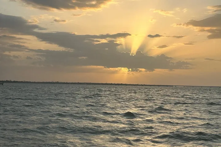 a sunset over a body of water